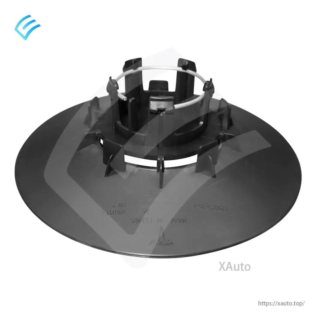 Close angled view of back of wheel center cap with plastic ribs, clip points, and metal spring ring
