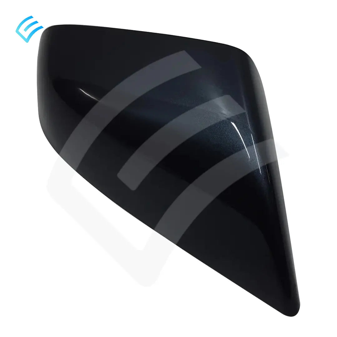 Passenger-side exterior mirror cap cover angled view showing smooth outer shell and pointed lower edge