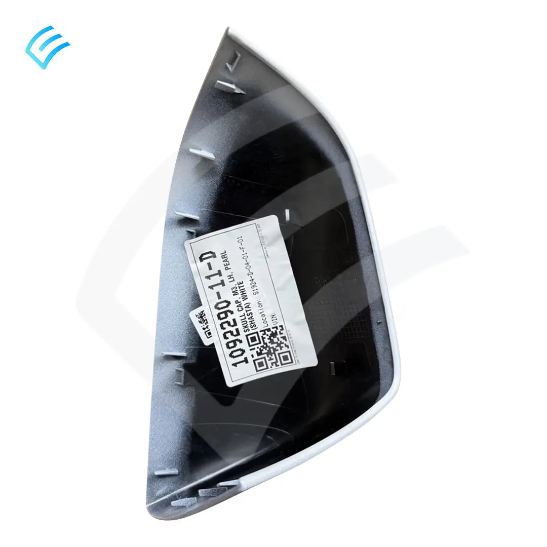 Back side of LH mirror skull cap showing mounting clips and OEM label sticker