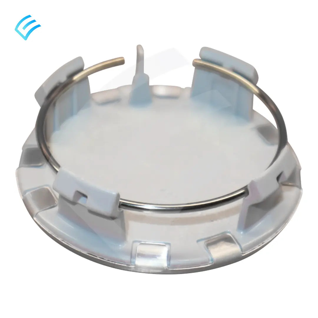 Back side of wheel center cap showing plastic clip tabs and metal retaining spring ring