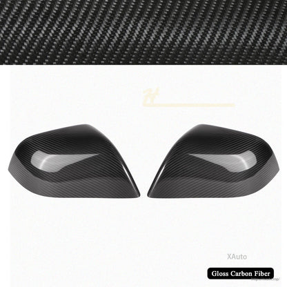 Pair of gloss carbon fiber mirror covers on white background with carbon weave banner
