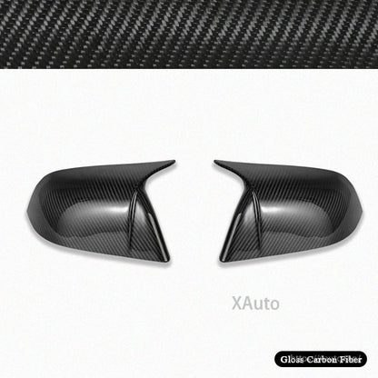 Gloss carbon fiber mirror covers shown from inner side angle, highlighting sharp outer ridge