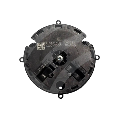 Outside mirror actuator assembly front view, round black housing with center drive and mounting tabs