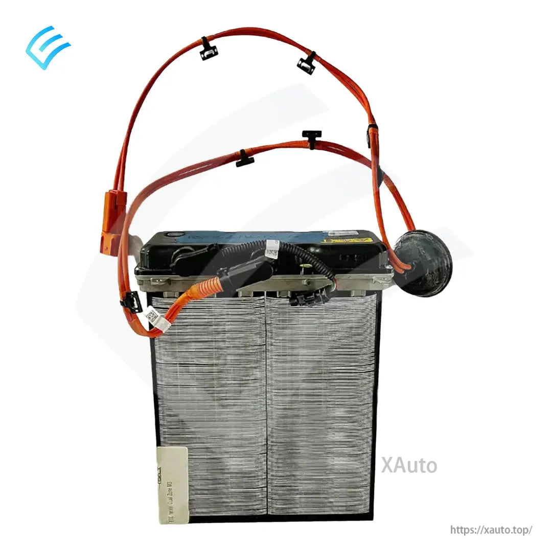 Top view of PTC heater assembly with orange cables, round sensor/port cover, and mounted connector leads