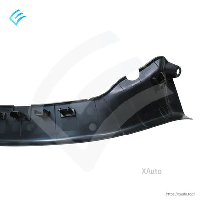Close-up of end section on Tesla Model 3 trunk garnish trim showing mounting ear and clip slots