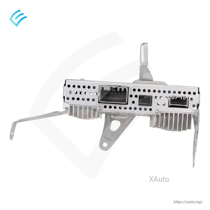 Front connector panel of Tesla audio amplifier with multi-pin ports and perforated metal housing