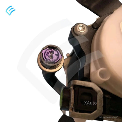 Close-up of purple electrical plug connector on Tesla seat belt retractor assembly