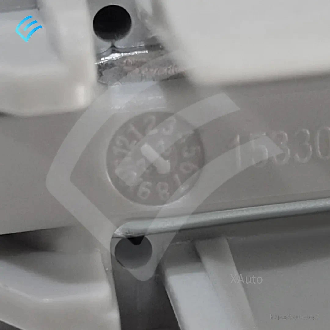 Close-up of molded date wheel stamp and plastic housing detail on the replacement part