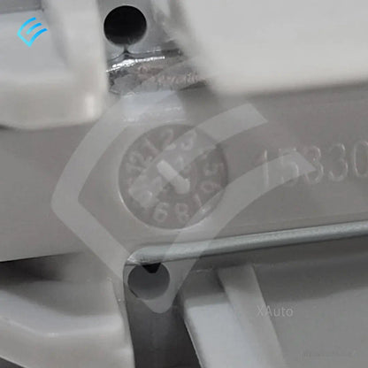 Close-up of molded date wheel stamp and plastic housing detail on the replacement part