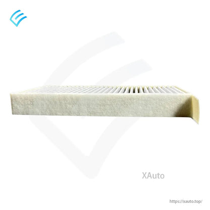 Side view of cabin filter with pull tab/edge flap, pleats visible across the top