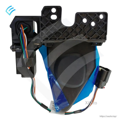 Back side of motorized charge port door with mounting grid bracket, wiring loom, and protective blue film