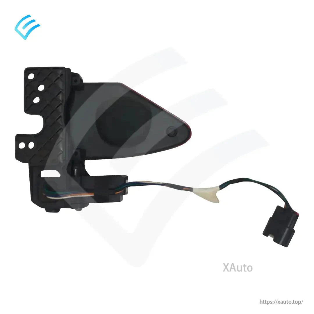 Rear view of charge port door assembly showing black inner flap, bracket holes, and wiring harness