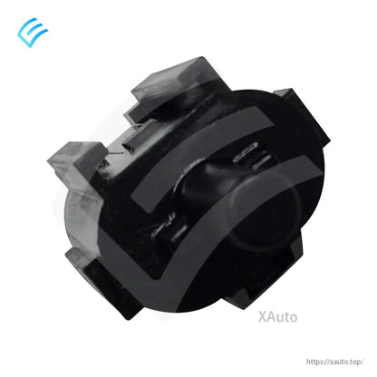 Underside view of the Tesla ambient air temperature sensor showing the circular mounting end