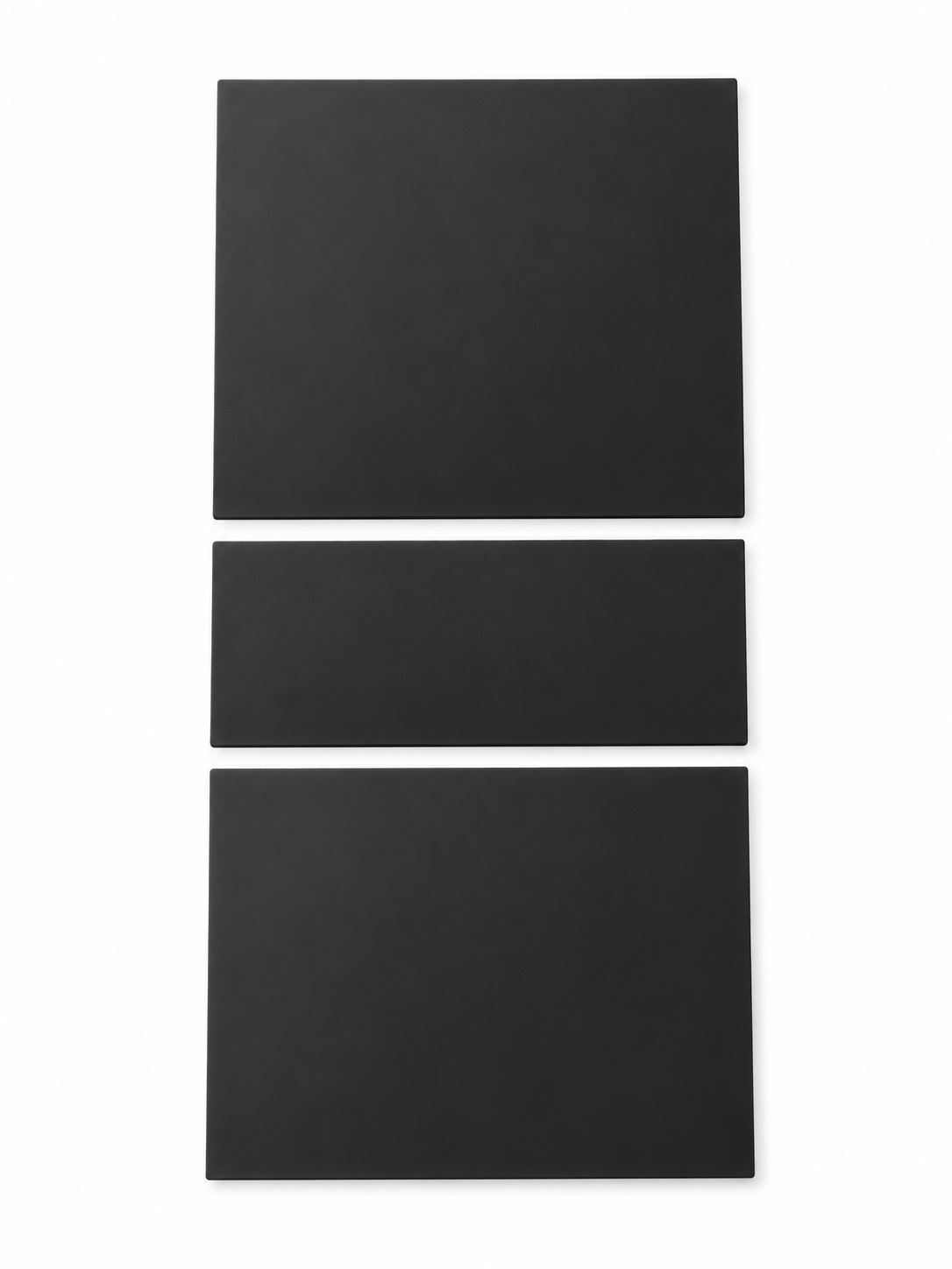 Black three-piece silicone console protector on white background