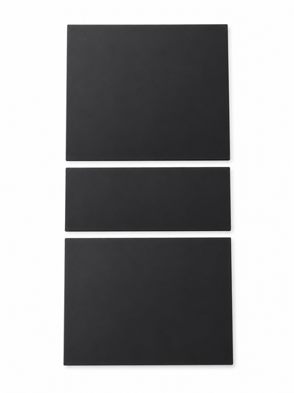 Black three-piece silicone console protector on white background